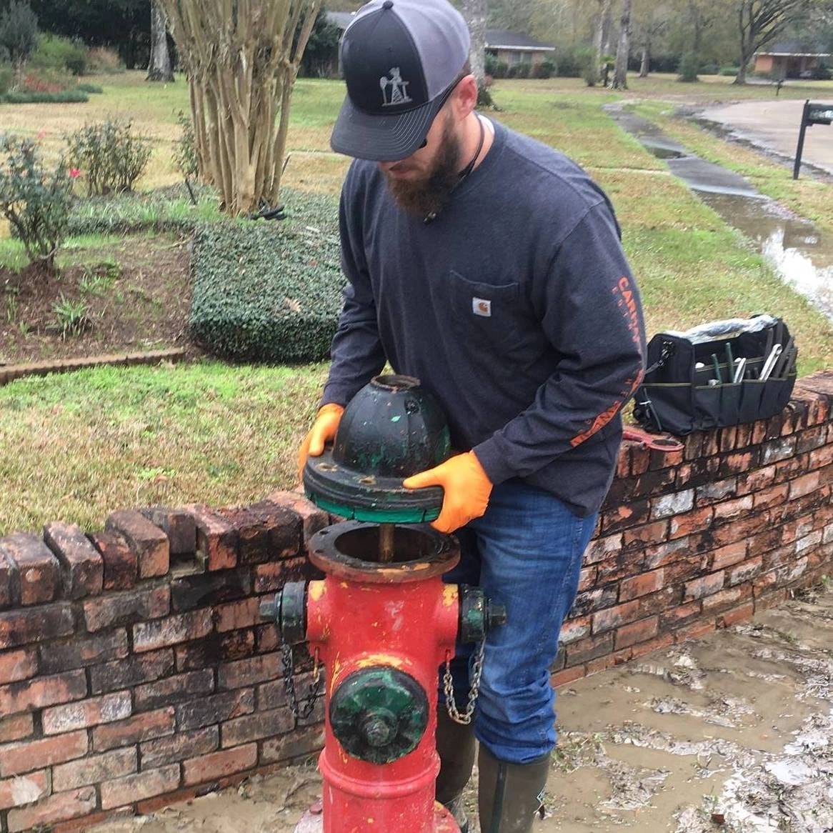 Hydrant repair worker performing field service